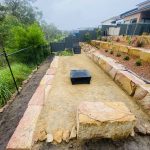 Sandstone log retaining wall terraces