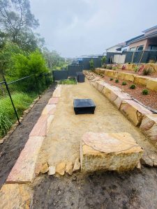 Sandstone log retaining wall terraces