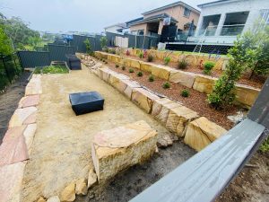 Sandstone log pillar retaining wall