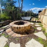 Sandstone steppers around brick fire pit