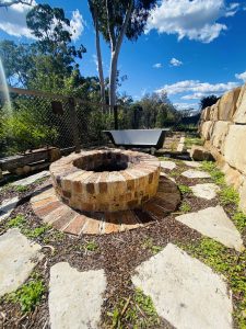 Sandstone steppers around brick fire pit