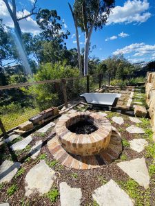 Fire pit with custom bath tub seat