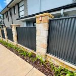 Sandstone fence pillar corrugated iron inserts