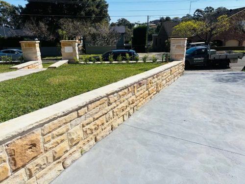 sandstone retaining wall for lawn and driveway