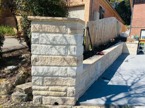 sandstone brick fence pier and retaining wall