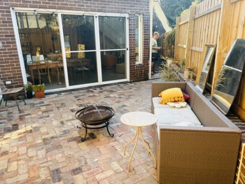 Recycled brick paved firepit area